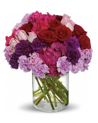 <p>Make a bold and breathtaking statement of love with a bouquet that captures the full intensity of passion and devotion. The Sweeping Romance Bouquet is a lavish display of color, fragrance, and elegance—crafted for moments when only the grandest expression will do.</p>
<p>This luxurious arrangement features dark pink hydrangea, red and lavender roses, deep purple and lavender carnations, hot pink freesia, and soft lavender phlox. Hand-designed in a clear cylinder vase, the mix of rich, romantic hues creates a dramatic and unforgettable presentation—perfect for sweeping someone off their feet.</p>
<p>Whether celebrating an anniversary, planning a romantic surprise, or simply expressing deep affection, the Sweeping Romance Bouquet says it all with bold color and refined beauty. Each bloom is chosen for its vibrancy and meaning, making this gift as thoughtful as it is stunning.</p>
<p>Handcrafted by expert florists, this bouquet is available for same-day delivery throughout local communities. Every arrangement is carefully prepared to ensure freshness, quality, and emotional impact.</p>
<p>Include a heartfelt message at checkout to complete your gift. With the Sweeping Romance Bouquet, you’re not just sending flowers—you’re making a lasting impression of love and admiration.</p>