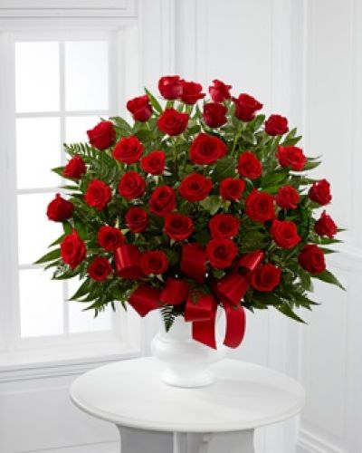 <p>Honor a cherished soul with a timeless display of beauty and heartfelt love. This arrangement features radiant red roses, each carefully chosen to represent enduring affection, deep admiration, and bonds that continue beyond parting.</p>
<p>This all-red rose tribute makes a powerful and moving statement at funerals, memorials, or celebrations of life. Set against lush premium greenery, the rich red roses rise with grace and confidence, offering a dignified and emotional farewell. Each bloom speaks of loyalty, strength, and lasting love.</p>
<p>Hand-arranged and presented with care, this design is crafted to be placed near the casket or at the front of a chapel. Its symmetrical lines and harmonious color palette provide peace and structure during uncertain moments. The simplicity of red roses makes this a classic tribute for honoring a deeply loved and respected parent, partner, or close friend.</p>
<p>Created with utmost attention by experienced florists, this sympathy arrangement is available for same-day delivery in the local area. Each order is handled with personal care, ensuring freshness and presentation that reflect your intentions with grace and dignity.</p>
<p>Sending this arrangement is more than a gesture—it is a message of unwavering love, reverence, and compassion. Add a personalized card during checkout to share your thoughts and remind the family they are not alone in their sorrow.</p>