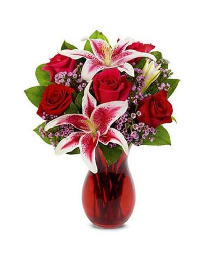 <p>Every great love story deserves a moment as breathtaking as the one being lived. This bouquet is designed to capture that emotion with flowers that speak louder than words. Overflowing with romance and beauty, this dreamy arrangement is perfect for celebrating someone who makes the heart skip a beat.</p>
<p>This captivating bouquet features classic red roses, fragrant stargazer lilies, and delicate pink waxflower—each bloom chosen for its elegance and symbolism. The roses express deep love and devotion, while the lilies add drama and sophistication. Soft waxflower accents provide texture and charm, all beautifully arranged in a sleek, clear glass vase that showcases the bouquet’s stunning shape and color. It is a floral love letter, crafted to perfection.</p>
<p>Ideal for anniversaries, Valentine’s Day, birthdays, or spontaneous romantic gestures, this bouquet turns any occasion into a heartfelt celebration. Its timeless mix of blooms and bold colors creates an unforgettable presentation sure to leave a lasting impression.</p>
<p>Each bouquet is carefully handcrafted with attention to detail and made fresh to order. Same-day delivery ensures the arrangement arrives fresh and ready to convey your feelings beautifully.</p>
<p>You can add a personal note at checkout to make your message even more special. This bouquet delivers love in the most beautiful and memorable way possible—elegantly, passionately, and from the heart.</p>