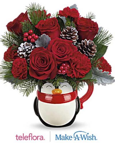 <p>Delight someone special this holiday season with a gift that’s equal parts adorable and heartwarming. The North Pole Penguin Bouquet isn’t just a festive floral arrangement—it’s a joyful experience filled with seasonal cheer. Whether you’re surprising a child, friend, teacher, or holiday host, this playful keepsake is sure to warm hearts and brighten homes.</p>
<p>The bouquet features a cheerful blend of holiday reds and frosted greens. Red roses and carnations set a classic tone, while miniature red carnations add a whimsical touch. Sprigs of dusty miller, Douglas fir, and white pine bring texture and a soft wintry feel, creating a fresh and cozy holiday look. All of this is hand-arranged in a ceramic penguin mug, complete with a cozy red scarf and an irresistible smile. Once the flowers fade, the mug becomes a charming keepsake—perfect for hot cocoa, tea, or coffee all winter long.</p>
<p>Ideal for holiday gifting, office surprises, or adding a cheerful accent to your own space, this bouquet is perfect for anyone who loves festive fun. The keepsake mug adds extra value and long-lasting charm, making it a favorite for kids, coworkers, and holiday parties alike.</p>
<p>Each bouquet is handcrafted by skilled local florists using the freshest seasonal blooms. Some flowers may arrive in bud form to ensure long-lasting beauty. Local delivery is available to ensure your gift arrives fresh, festive, and full of personality.</p>
<p>Send the North Pole Penguin Bouquet today and share a holly jolly surprise that brings instant joy—and cozy moments to come.</p>