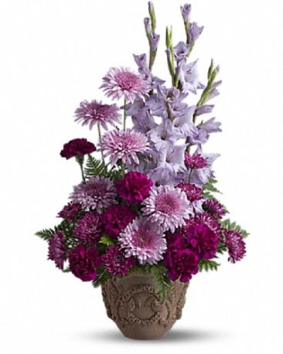 <p>Honor a cherished life with a floral tribute that expresses deep love, sympathy, and respect. This majestic arrangement is designed to celebrate someone who brought depth and beauty to the lives of those around them, serving as a meaningful symbol of enduring affection.</p>
<p>The design showcases an elegant mix of lavender and purple blooms, including gladioli, carnations, and cushion spray chrysanthemums. Accented with graceful ferns, these flowers are arranged thoughtfully to create a full and balanced display. The arrangement is presented in a classic Grecian-style urn that adds a timeless and dignified element, enhancing the overall sense of reverence.</p>
<p>Ideal for funeral services, memorials, and wakes, this impressive tribute offers comfort and solace. Its rich hues and striking height make it an appropriate choice to honor a loved one, providing a thoughtful expression of remembrance for friends, family members, or colleagues during moments of reflection.</p>
<p>Each bouquet is carefully handcrafted with precision and care, using fresh, high-quality blooms to ensure lasting beauty and freshness. The arrangement is prepared to arrive in pristine condition, reflecting the importance of the occasion and the sincerity of the sentiments it conveys. Personal messages can be included to deepen the expression of condolences and support.</p>
<p>Sending this arrangement means offering more than just flowers—it delivers a lasting tribute that comforts, honors, and remembers. It stands as a heartfelt expression of sympathy and respect, celebrating the treasured memories of a life well lived and the profound impact left behind.</p>