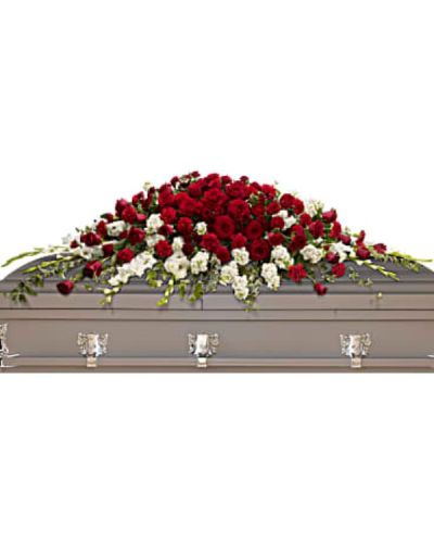 <p>Pay tribute to a life of deep love and enduring devotion with a traditional and dramatic casket spray. This striking arrangement combines red and white blooms, symbolizing both passionate remembrance and peaceful farewell. Designed for a full couch or closed casket, it makes a powerful and heartfelt statement at the service.</p>
<p>The spray features rich red roses and carnations, expressing love, admiration, and loyalty. These bold blooms are beautifully balanced by pure white gladioli and white stock, which bring an air of serenity and spiritual grace to the arrangement. Lush greenery, including variegated ivy and salal, adds texture and natural fullness, enhancing the overall elegance and presence of the display.</p>
<p>This spray is an ideal choice for honoring a spouse, parent, or cherished family member whose legacy is rooted in strength, love, and lasting connection. The red and white palette captures both the intensity of grief and the purity of your tribute, offering comfort and dignity in equal measure.</p>
<p>Each spray is handcrafted with care by expert florists. Same-day delivery is available to funeral homes and memorial locations to ensure your tribute is delivered fresh, full, and presented with care.</p>
<p>Add a personal message at checkout to share your thoughts or express your love. Commemorate life’s most meaningful moments with a timeless and majestic floral farewell that speaks from the heart.</p>
