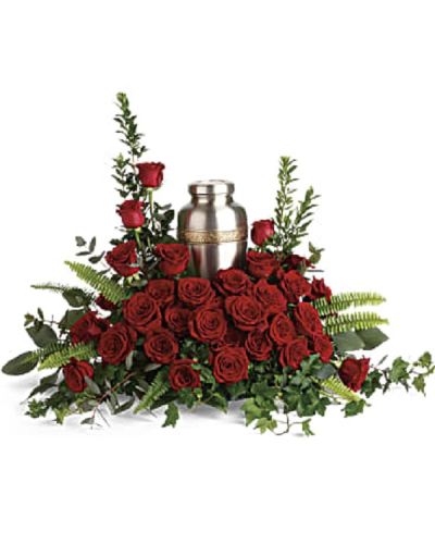 <p>Express your enduring love and heartfelt remembrance with a floral tribute that honors a cherished life. This elegant arrangement is designed to beautifully complement a cremation urn and offer comfort to grieving hearts.</p>
<p>The design features rich red roses paired with delicate greenery including myrtle, green ivy, sword fern, silver dollar eucalyptus, and lemon leaf. The combination creates a lush, textured display that radiates warmth, respect, and lasting affection.</p>
<p>Ideal for families seeking a meaningful tribute to accompany a cremation urn, this arrangement symbolizes deep love and remembrance. Please note the arrangement does not include the urn itself and serves as a floral complement.</p>
<p>Each tribute is handcrafted by expert florists who ensure it arrives fresh and thoughtfully prepared. Same-day delivery is available to provide timely and compassionate service.</p>
<p>Include a personal message to accompany your floral gift. This tribute sends a beautiful symbol of love and honor that lasts beyond words.</p>