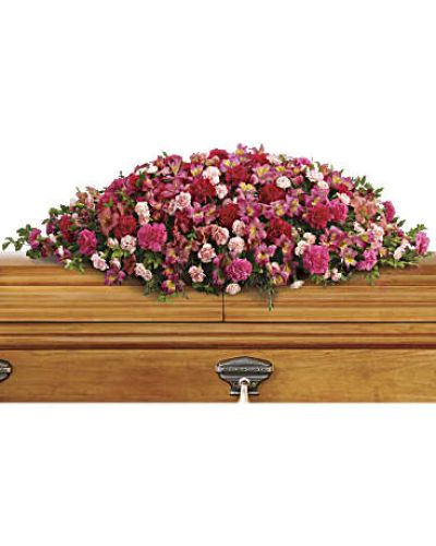 <p>Honor a beautiful soul with a graceful floral spray that captures the tenderness, affection, and deep respect felt for someone dearly missed. Overflowing with shades of pink, this cascading arrangement serves as a heartfelt expression of love, offering comfort and warmth during a time of farewell.</p>
<p>This elegant tribute features a rich blend of pink favorites, including dark pink alstroemeria, hot pink carnations, classic pink carnations, and miniature light pink carnations. Each bloom is carefully arranged to create a natural cascade, symbolizing an outpouring of love that continues beyond parting. The flowers are accented with fresh huckleberry and soft eucalyptus, adding texture, fullness, and a touch of serene greenery to the design.</p>
<p>This arrangement is an ideal choice for memorial services, funeral ceremonies, or celebration of life events. Its warm pink tones reflect compassion, remembrance, and heartfelt gratitude for a life that brought joy to others. It is especially suited for honoring a mother, grandmother, sister, or close friend whose love and kindness left a lasting impact.</p>
<p>Each spray is handcrafted with care using fresh, premium blooms and delivered with professionalism and compassion. Same-day delivery is available to funeral homes and service locations to ensure your tribute arrives on time and in beautiful condition.</p>
<p>Include a personal message of sympathy at checkout to accompany your floral arrangement. Express enduring love and remembrance through flowers that speak from the heart. Celebrate a legacy that lives on with a beautiful and meaningful tribute.</p>