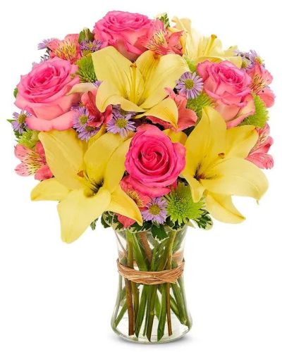 <p>There’s no better way to say “Happy Birthday” than with a bouquet that bursts with energy and joy. Bright, cheerful, and full of life, this arrangement turns any birthday into a celebration to remember. Whether you’re surprising a friend, loved one, or colleague, this floral gift delivers instant smiles and festive charm.</p>
<p>The bouquet showcases a lively mix of sunny yellow blooms, radiant pink roses, and petite accent flowers in a playful blend of complementary colors. Each stem is chosen for its brilliance and freshness, with warm yellows creating a joyful base and bright pinks adding a loving pop. Pops of orange, lavender, or purple bring added depth and contrast, while the classic glass vase keeps the look polished and timeless.</p>
<p>Perfect for birthdays of all kinds—from milestone moments to sweet sixteens or thoughtful gestures—this design spreads happiness wherever it goes. Its colorful palette and spirited composition make it ideal for kitchen counters, office desks, party tables, or doorstep surprises.</p>
<p>Every arrangement is handcrafted with care by an experienced florist and delivered fresh for lasting impact. Natural variations in flower selection may occur based on seasonal availability, but the bouquet’s vibrant feel and festive personality will always shine through. Some blooms may arrive in bud form to maximize longevity and enjoyment.</p>
<p>Celebrate someone special with a gift that’s joyful, colorful, and full of love—a floral tribute to another beautiful year ahead.</p>