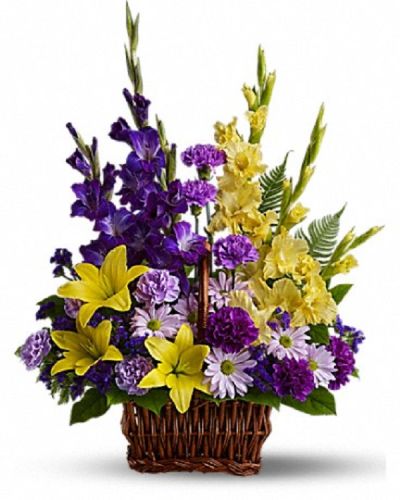 <p>Celebrate the memory of a dearly missed loved one with a floral tribute that offers both strength and comfort. This vibrant arrangement is thoughtfully designed to bring solace and hope during a difficult time.</p>
<p>The bouquet features a vivid mix of fresh blooms including yellow Asiatic lilies and gladioli, purple carnations, statice, lavender carnations, and chrysanthemums. Hand-arranged in a rectangular basket with a handle, the colorful combination creates a lively yet respectful display.</p>
<p>Ideal for funeral homes, memorial services, or to send directly to grieving family and friends, this basket conveys heartfelt condolences with grace and warmth. The contrasting colors symbolize remembrance, peace, and enduring affection.</p>
<p>Each arrangement is handcrafted by skilled florists who ensure it arrives fresh and beautifully presented. Same-day delivery is available to provide timely and thoughtful service.</p>
<p>Include a personal message to share your support and love. This basket sends more than flowers—it sends a meaningful tribute that comforts and honors a treasured life.</p>