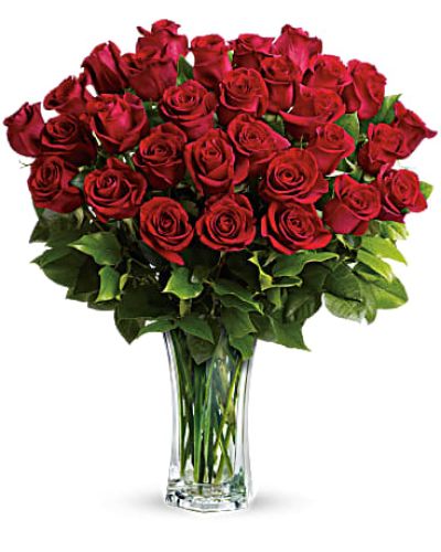 <p>Declare your love in a timeless and breathtaking way with this luxurious bouquet of premium red roses. It offers an unforgettable expression of passion and commitment, perfect for anniversaries, romantic surprises, or milestone moments.</p>
<p>Each arrangement features 24, 30, or 36 hand-selected red roses, depending on the size chosen. These elegant blooms are arranged in a cut crystal vase that adds sparkle and sophistication. The long stems and deep crimson color evoke classic romance, while the artistic design adds a modern edge.</p>
<p>Ideal for Valentine’s Day or any occasion to make a powerful romantic statement, the crystal vase elevates the bouquet into a keepsake to be treasured for years. Every rose is fresh, full, and arranged with care to ensure your gift looks as amazing as it feels.</p>
<p>Handcrafted by expert florists, each bouquet is made to order and delivered by hand. Same-day flower delivery is available locally, ensuring your gift arrives on time, perfectly arranged, and ready to impress.</p>
<p>Choose from three sizes: Standard with 24 roses, Deluxe with 30 blooms, or Premium with 36 exquisite roses. Add a personal message during checkout to make this stunning gift truly unforgettable. Order today and make their heart bloom with love.</p>