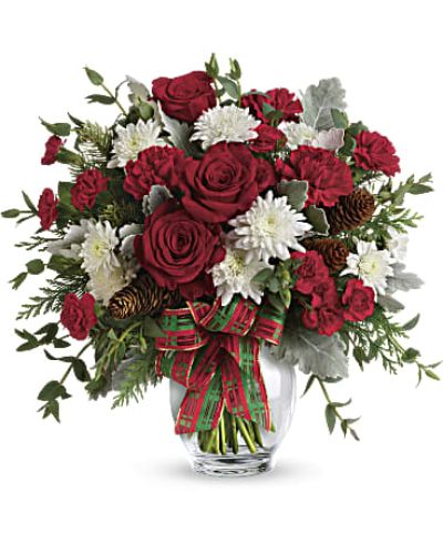 <p>Add a touch of elegance to your holiday season with a bouquet that shines with timeless beauty and festive charm. This sophisticated arrangement evokes the warmth of classic celebrations, blending tradition and sparkle into a gift that’s sure to be remembered.</p>
<p>Brimming with crimson roses, snowy white chrysanthemums, and lush winter carnations, the bouquet is accented by aromatic holiday greens like cedar and fir. Every stem is thoughtfully arranged in a graceful ginger jar vase, tied with a plaid ribbon for a refined seasonal look that’s as cozy as it is polished.</p>
<p>Perfect as a heartfelt gift for loved ones or a statement centerpiece in your own home, this bouquet brings joy to Christmas gatherings, winter birthdays, anniversaries, or simple seasonal moments. It’s ideal for anyone who appreciates a blend of festive color and timeless style.</p>
<p>Each arrangement is handcrafted by a local floral expert, ensuring freshness and care in every detail. While certain flowers or greenery may vary based on availability, the bouquet always arrives with the same spirit of holiday elegance.</p>
<p>Celebrate winter’s beauty with a bouquet that sparkles with tradition and style—perfect for spreading cheer that feels both heartfelt and refined.</p>