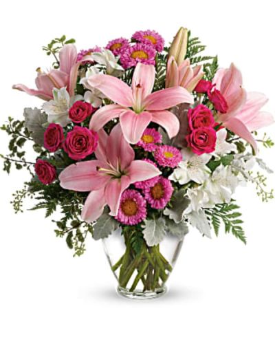 <p>Bring a rush of sweetness and elegance into someone’s day with this dreamy bouquet filled with soft pink tones and delicate textures. Whether celebrating a birthday, anniversary, romantic gesture, or spontaneous surprise, this luxurious arrangement is designed to make hearts flutter and cheeks glow. It’s the kind of floral gift that feels both effortless and extraordinary—perfect for someone who deserves a little pampering.</p>
<p>This graceful design features hot pink spray roses and elegant pink Asiatic lilies, surrounded by white alstroemeria and pink matsumoto asters for layers of color and charm. The arrangement is accented with seeded eucalyptus, leatherleaf fern, dusty miller, and pitta negra, creating a lush and modern mix of greenery that enhances the feminine color palette. Hand-arranged in a soft pink vase, the flowers feel fresh and romantic with just the right amount of sophistication.</p>
<p>This bouquet is ideal for expressing admiration, affection, or appreciation. Its soft pink tones symbolize gentle love, grace, and happiness, making it perfect for partners, close friends, or family members. It’s also a popular choice for bridal showers, Mother’s Day, or as a thoughtful “just because” gesture that says, “You’re on my mind.”</p>
<p>Each bouquet is designed and handcrafted with care to ensure freshness and beauty. Same-day delivery is available to ensure your gift arrives perfectly presented and ready to brighten someone’s day. Every arrangement reflects expert artistry and personal attention.</p>
<p>Add a sweet message at checkout to share what’s in your heart. Whether near or far, this bouquet is the perfect way to send beauty, warmth, and a touch of pink magic. Let your affection bloom with a gift that speaks from the heart.</p>