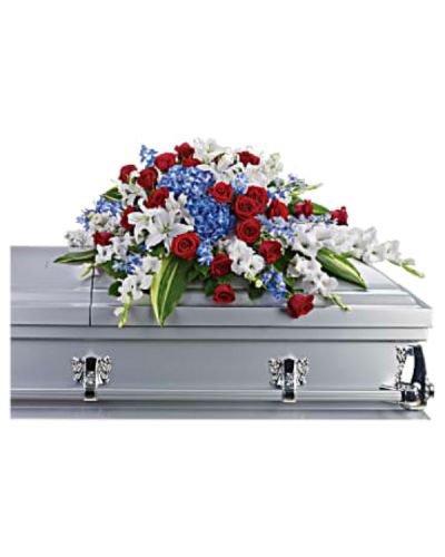 <p>Honor a life dedicated to service with a proud and timeless casket spray designed to reflect the values of courage, sacrifice, and love of country. This elegant half-couch arrangement offers a powerful and dignified tribute for military funerals, veterans, or anyone who held deep pride in their nation.</p>
<p>This striking display features bold blue hydrangea and delphinium, symbolizing loyalty and peace. They are beautifully paired with classic red roses for love and bravery, and white oriental lilies and gladioli for purity and honor. The red, white, and blue palette mirrors the colors of the American flag, creating a heartfelt salute to a life of service. The flowers are carefully arranged for a graceful, symmetrical presentation, resting atop the casket with reverence and strength.</p>
<p>Ideal for both military and civilian funerals, this spray is a meaningful way to show respect for someone who lived with integrity and gave selflessly to others. It serves as a visual expression of gratitude and remembrance, comforting loved ones while honoring the legacy of the one who has passed.</p>
<p>Each arrangement is expertly handcrafted with care by local florists. Same-day delivery is available to funeral homes and service locations to ensure your tribute arrives fresh, elegant, and on time. Every detail is handled thoughtfully, from the choice of blooms to the presentation.</p>
<p>Add a personal note at checkout to express condolences or share a few words in memory of your loved one. Honor distinguished service with beauty and grace through a floral tribute that speaks of pride, dignity, and heartfelt thanks.</p>