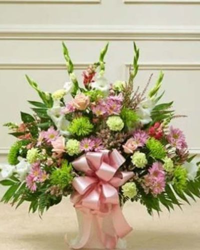 <p>In moments of loss, a gentle expression of care can provide lasting comfort. This floor basket in pastel offers a soft and heartfelt way to convey sympathy with grace and sincerity. Its delicate palette and thoughtful design beautifully reflect love, remembrance, and peace.</p>
<p>The arrangement features a hand-gathered selection of fresh pastel roses, gladiolas, snapdragons, mums, carnations, daisy poms, heather, and seasonal greenery. The lush, uplifting floor basket radiates warmth and compassion. With its tall structure and layered textures, it makes an elegant statement at any memorial or funeral service.</p>
<p>Perfect for sending from friends, family members, or business associates, this basket honors a life well lived and offers support to those left behind. The pastel tones create a sense of calm and comfort, making it a timeless tribute suitable for any service or setting.</p>
<p>Each floor basket is carefully crafted by expert florists with attention to detail and care. Same-day delivery to funeral homes and service venues ensures your sentiment arrives fresh and respectfully presented.</p>
<p>Including a heartfelt message at checkout allows you to personalize your gift. With every bloom thoughtfully placed, this arrangement offers a meaningful way to say, “I’m with you,” even when you cannot be there in person.</p>