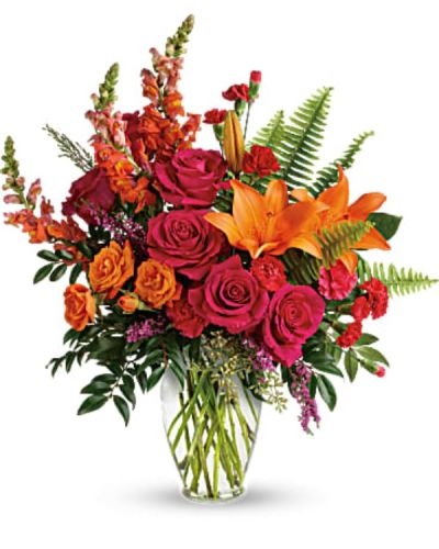 <p>Send a surge of happiness straight to their heart with a vibrant bouquet that radiates energy, joy, and confidence. Designed to lift moods and turn ordinary days into unforgettable ones, this bold blend of saturated hues is perfect for anyone who could use a cheerful pick-me-up. Whether sending love, thanks, or just because, this arrangement speaks volumes without saying a word.</p>
<p>This bouquet bursts with personality, featuring hot pink roses, orange spray roses, fiery orange asiatic lilies, and rich hot pink carnations. Red miniature carnations, lively orange snapdragons, and pink heather round out the color story with layered texture and dimension. Accented by lush greens including sword fern, huckleberry, seeded eucalyptus, and lemon leaf, the bouquet is arranged in a sleek clear glass vase that complements the vivid palette without distraction.</p>
<p>Perfect for birthdays, congratulations, thank-you gifts, or any moment that calls for something bright and bold, this arrangement delivers an emotional high note. Its sunset-inspired colors bring warmth and excitement into any room, making it a popular choice for celebrations, milestones, and spontaneous gestures of kindness.</p>
<p>Each bouquet is carefully handcrafted with attention to detail and made fresh to order. Same-day delivery is available throughout the local area, with every arrangement hand-delivered for a personal, polished experience. No drop shipping or guesswork—just beautifully curated flowers from local hands to the recipient’s door.</p>
<p>You can add a personal message at checkout to make the gift even more meaningful. Whether near or far, this bouquet helps make every moment brighter, bolder, and more beautiful.</p>