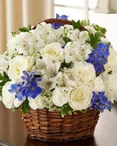 <p>In moments of loss, a gentle gesture can provide unexpected comfort. The Peace, Love & Hope Basket in blue and white offers a serene and elegant way to express sympathy, sending a message of peace, remembrance, and quiet strength to those who need it most.</p>
<p>This refined arrangement features soft white roses, delicate delphinium, alstroemeria, carnations, mini carnations, and airy monte casino. Fresh greenery, including variegated pittosporum and myrtle, enhances the design’s natural beauty. Arranged in a charming handled basket, the blend of cool blue and clean white tones evokes calm, hope, and heartfelt reverence.</p>
<p>Ideal for sending condolences to a memorial service or directly to a loved one’s home, this basket provides a thoughtful way to honor the life of someone deeply missed. The blue and white color palette symbolizes faith, tranquility, and remembrance, bringing comfort in a time of sorrow.</p>
<p>Each basket is handcrafted by skilled florists with care and attention to detail. Reliable same-day delivery is available to local homes and funeral locations, ensuring your tribute arrives with care and dignity.</p>
<p>Including a personal sympathy message at checkout allows you to express your support further. Let this graceful basket be a reminder that they are not alone—that your prayers, love, and thoughts are with them.</p>