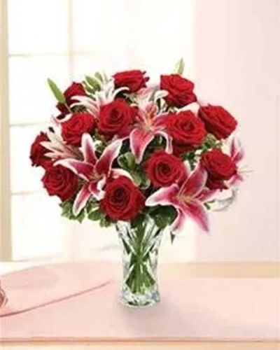 <p>Some gestures say everything. The Love’s Incarnation Rose & Lily Bouquet embodies timeless romance—a luxurious gift designed to sweep them off their feet and express your deepest love with unforgettable beauty.</p>
<p>This elegant arrangement features long-stemmed red roses and graceful lilies, hand-gathered with fresh pittosporum and carefully styled in a dazzling heirloom crystal vase. The rich reds and soft whites create a stunning visual contrast, while the crystal vessel adds lasting value and classic charm to this romantic gift.</p>
<p>Ideal for anniversaries, Valentine's Day, or moments when words fall short, this bouquet speaks volumes about devotion, passion, and enduring love. Whether celebrating a milestone or creating one, this bouquet makes the moment unforgettable.</p>
<p>Lovingly arranged by expert florists, each Love’s Incarnation Rose & Lily Bouquet is prepared fresh and delivered with care. Same-day flower delivery is available throughout local communities, ensuring your grand romantic gesture arrives in perfect form.</p>
<p>Add a heartfelt message at checkout to make your gift even more personal. Let Love’s Incarnation capture the feeling that only flowers—and you—can deliver so beautifully.</p>