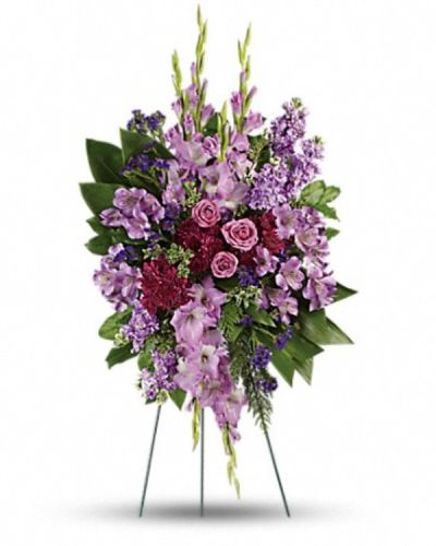 <p>Offer a graceful expression of sympathy with a floral tribute that brings comfort and peace. This majestic standing spray is thoughtfully designed to honor a life well loved with elegance and heartfelt remembrance.</p>
<p>The arrangement features a harmonious blend of lavender roses, alstroemeria, gladioli, and stock. These blooms are complemented by purple cushion spray chrysanthemums, sinuata statice, and lush greenery including green ti leaves, flat cedar, oregonia, and lemon leaf. Together, they create a rich, textured display full of depth, softness, and serene beauty.</p>
<p>Ideal for memorial services and funerals, this tribute serves as a meaningful expression of grace, dignity, and peaceful reflection. Its gentle lavender hues symbolize calm and remembrance, offering solace and comfort to grieving family and friends during difficult times.</p>
<p>Each arrangement is carefully handcrafted by skilled florists who select fresh, high-quality blooms and arrange them with artistry and care. Prepared and delivered promptly, the tribute arrives fresh and thoughtfully prepared to convey your deepest sympathies. Personalized messages can be added at checkout to accompany this heartfelt gift and deepen its meaning.</p>
<p>Sending this standing spray means offering more than flowers—you share a lasting symbol of love, comfort, and remembrance. It stands as a beautiful tribute that honors cherished memories and supports those who mourn with dignity and compassion.</p>