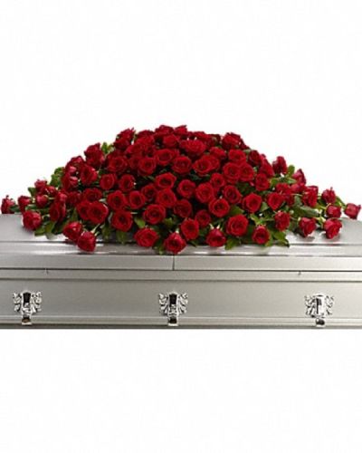 <p>Express your deepest love and respect with a floral tribute that speaks from the heart. This rich and regal casket spray is designed to honor a cherished life with timeless elegance.</p>
<p>The full spray features an abundant display of crimson red roses, expertly arranged with alternating large and slightly smaller stems to create depth and texture. The all-red palette symbolizes passion, love, and enduring remembrance, making it a powerful tribute for a final farewell.</p>
<p>Ideal for family members wishing to adorn the casket with a meaningful expression of devotion, this spray adds a dignified and beautiful presence to any funeral or memorial service. Its classic style communicates profound respect and heartfelt sentiment.</p>
<p>Each spray is handcrafted by skilled florists who ensure it arrives fresh and carefully presented. Same-day delivery is available to provide timely and thoughtful service.</p>
<p>Include a personal message to accompany your floral tribute. This casket spray sends a lasting symbol of love and remembrance that honors a life deeply cherished.</p>