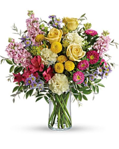 <p>Share a burst of sunshine and joy with this vibrant floral arrangement designed to lift spirits and brighten any room. With its cheerful color palette and dazzling variety of textures, this bouquet is more than just beautiful. It is a heartfelt gesture of positivity, warmth, and hope. Perfect for celebrating life’s happy moments or sending an encouraging note, it is an unforgettable way to say “I’m thinking of you.”</p>
<p>This lively arrangement overflows with yellow roses and pink roses, creating a stunning foundation of warmth and sweetness. They are joined by red alstroemeria, light yellow carnations, pink stock, hot pink matsumoto asters, and lavender monte cassino asters for a full-spectrum bouquet that delights the senses. Yellow button spray chrysanthemums add playful pops of texture, while bupleurum, huckleberry, and parvifolia eucalyptus bring natural balance and lush greenery to the design. The blooms are thoughtfully arranged in a sleek clear cylinder vase, perfect for showcasing the colors and keeping the focus on the flowers themselves.</p>
<p>This bouquet is the ideal pick-me-up for birthdays, get-well wishes, thank-you gifts, or any time you want to make someone smile. Its joyful hues and uplifting energy make it especially well suited for celebrating milestones, showing appreciation, or simply spreading happiness when it is needed most. Whether it is for a friend, family member, or colleague, this bouquet delivers your message with cheerful elegance.</p>
<p>Each arrangement is handcrafted with care to ensure freshness and beauty. Same-day delivery is available to ensure your thoughtful gift arrives fresh, vibrant, and right on time. Every order reflects personal service and local pride.</p>
<p>Add a custom message at checkout to make your delivery even more meaningful. Send a little goodness and light with a bouquet that speaks from the heart and lets joy bloom.</p>