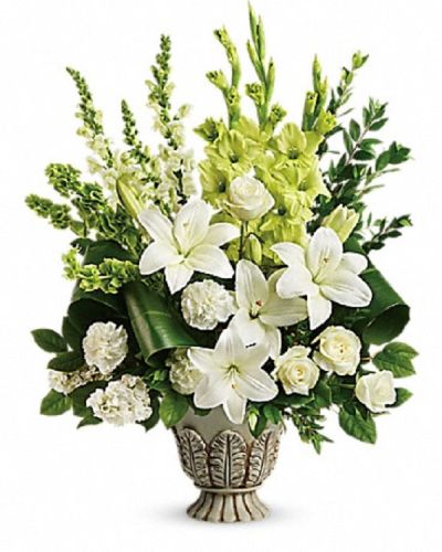 <p>Offer a message of peace and heavenly remembrance with an arrangement designed to bring comfort and serenity. This stunning floral tribute provides a graceful way to honor a life filled with light, love, and gentle strength, offering solace during difficult times.</p>
<p>The elegant design features a harmonious blend of white roses, Asiatic lilies, carnations, snapdragons, and stock. Accents of green gladioli, Bells of Ireland, lemon leaf, myrtle, and green ti leaves add depth and contrast. All blooms are thoughtfully arranged in a large antiqued pot, lending the tribute a timeless character that enhances its heartfelt meaning.</p>
<p>This arrangement is ideal for funerals, memorial services, or sympathy gestures. Its soft whites and fresh greens evoke a sense of calm and reverence, making it a thoughtful choice to express support and sympathy to family, friends, or colleagues. The combination of colors symbolizes spiritual peace and enduring affection, providing comfort when words alone are not enough.</p>
<p>Each bouquet is handcrafted with care, using only the freshest blooms and artistic attention to detail. The arrangement is prepared to maintain its beauty and freshness, ensuring that every element contributes to a dignified and lasting tribute. Personal messages can be included to further convey your heartfelt sentiments.</p>
<p>With this arrangement, you send more than flowers—you send a lasting expression of comfort, love, and remembrance. It stands as a meaningful tribute that reflects peace and the enduring beauty of cherished memories, offering a gentle reminder that those we honor remain forever in our hearts.</p>