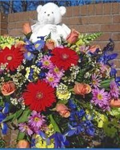 <p>In life’s most delicate and sorrowful moments, flowers can offer a quiet form of comfort when words feel impossible. This tender casket cover is designed to honor an infant or young child with a sense of softness, love, and grace. Gentle and heartfelt, it provides a visual embrace for a life that, though brief, brought profound meaning and deep connection.</p>
<p>The arrangement features a blend of pastel blooms such as soft pink roses, miniature carnations, delicate daisies, baby’s breath, and seasonal accents. Hues of pink, white, blue, or lavender may be used to reflect family wishes or the memory of the child being honored. Resting atop a bed of fresh greenery, the flowers are arranged with care to create a soothing and peaceful design. Cascading edges gently frame the casket, offering a comforting presence at the service.</p>
<p>This petite tribute is suited for infant and child-sized caskets and is appropriate for memorials, funerals, or private family gatherings. It speaks quietly to the innocence of the life it remembers, offering a symbol of love, tenderness, and remembrance. The arrangement provides a space for reflection and reverence, surrounding grief with beauty and peace.</p>
<p>Each cover is handcrafted using fresh blooms selected for their purity and gentle presence. The careful design ensures that every detail reflects the sensitivity of the moment. With its small size and intentional softness, the arrangement creates a meaningful tribute that supports the family with a heartfelt visual expression of love and shared sorrow.</p>
<p>Let this delicate floral piece serve as a loving farewell, honoring a life that touched hearts in its own special way. Through gentle blooms and quiet color, it offers solace and remembrance, wrapping a family’s grief in beauty, tenderness, and grace.</p>