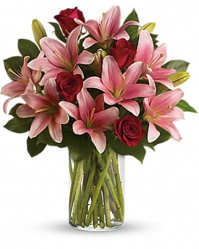 <p>Transform any day into a magical moment with a bouquet that captivates the heart and delights the senses. This stunning arrangement offers a heartfelt expression of love and admiration, designed to make someone feel truly special and cherished.</p>
<p>The bouquet features rich red roses paired with magnificent pink lilies, accented by fresh lemon leaves that add vibrant greenery and texture. Each bloom is carefully selected and hand-arranged to create a lush and enchanting display that uplifts the spirit and awakens the senses.</p>
<p>Perfect for anniversaries, birthdays, or simply to say “I care,” this bouquet pampers with its fragrant blooms and striking colors. It serves as a thoughtful way to express affection and bring a touch of enchantment to any day.</p>
<p>Each arrangement is handcrafted by expert florists who ensure every flower is fresh and beautifully presented. Prepared and delivered promptly, the bouquet arrives vibrant and ready to convey your warmest sentiments. Personalized messages can be added at checkout to make your gift even more memorable.</p>
<p>Sending this bouquet means offering more than flowers—you share a magical experience wrapped in beauty and care. It stands as a lasting symbol of love and thoughtfulness, perfect for celebrating the moments that truly matter.</p>
