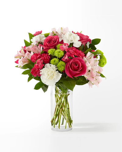 <p>When words are hard to find, flowers offer a gentle way to express warmth, care, and appreciation. This charming bouquet brings a touch of brightness to any moment, offering an elegant blend of color and texture that lifts the spirit. Whether celebrating a special occasion or simply letting someone know they’re on your mind, this arrangement delivers heartfelt joy with every bloom.</p>
<p>At the center of the bouquet are vivid hot pink roses, celebrated for their bold beauty and joyful energy. They’re complemented by soft pink alstroemeria, whose delicate petals and detailed markings add texture, balance, and quiet charm. Lush greenery and seasonal filler flowers frame the main blooms, enhancing their presence while preserving the bouquet’s gentle, feminine appeal.</p>
<p>The flowers are arranged in a modern glass cylinder vase that suits a wide range of spaces. Its rounded, compact shape is ideal for desks, coffee tables, nightstands, or windowsills, making it a versatile choice for homes, offices, or hospital rooms. Wherever it is placed, the bouquet brings a graceful burst of color and a touch of serenity.</p>
<p>This floral gift is perfect for birthdays, thank-you moments, well wishes, or thoughtful surprises. Its soft pink palette and approachable style make it suitable for mothers, daughters, friends, or coworkers. Whether offered during spring celebrations or quiet everyday gestures, the bouquet delivers a message of kindness, admiration, and presence.</p>
<p>Let this graceful bouquet be your way of bringing light into someone’s day. With its vibrant roses, delicate accents, and thoughtful design, it becomes more than just flowers—it becomes a heartfelt reminder of connection, care, and joy.</p>