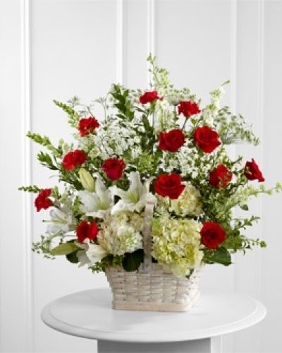 <p>Honor a cherished life with a floral tribute that speaks through elegance and heartfelt beauty. This stunning arrangement expresses deep sympathy during life’s most tender moments with a thoughtful blend of blooms.</p>
<p>The design features red roses and carnations symbolizing love and admiration, combined with soothing white Oriental lilies, hydrangeas, snapdragons, and larkspur. Delicate Queen Anne’s Lace adds airy texture, evoking purity and peaceful reflection. The mix of bold reds and serene whites offers a comforting balance of emotional warmth and calm.</p>
<p>Each stem is hand-placed in a large whitewashed rectangular basket, chosen for its rustic elegance and timeless appeal. This natural container grounds the tribute in simplicity and warmth, making it a fitting focal point for services, memorials, or funeral homes.</p>
<p>Crafted by experienced florists, this sympathy arrangement is available for same-day delivery with care and professionalism. Coordination ensures respectful and timely presentation.</p>
<p>Add a personal note during checkout to share your thoughts and bring comfort. This arrangement serves as a message of love, respect, and peace for those who need it most.</p>