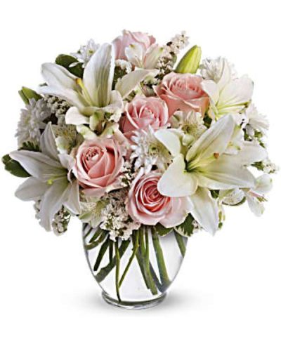 <p>Say everything without saying a word with a soft and elegant bouquet that speaks the language of love through delicate blooms and timeless beauty. Designed to impress from the very first glance, this arrangement is the perfect gift for anniversaries, romantic surprises, or simply letting someone know they are deeply cherished.</p>
<p>This exquisite design features light pink roses paired with graceful white asiatic lilies, white alstroemeria, and cushion spray chrysanthemums. Accents of white statice and variegated pittosporum add texture and fullness, while the clear, rounded ginger vase offers a clean and classic presentation that highlights the gentle pastel palette.</p>
<p>This bouquet is a versatile favorite, ideal for sweethearts, close friends, or family members who appreciate elegance and softness. The pink and white tones symbolize admiration, grace, and pure affection, creating a thoughtful and warm floral expression.</p>
<p>Each arrangement is carefully handcrafted with attention to detail and made fresh to order. Same-day delivery ensures the bouquet arrives fresh, full, and ready to make a lasting impression.</p>
<p>You can add a personal note at checkout to make your delivery even more special. This bouquet shares beauty, love, and a moment to remember with style and grace.</p>