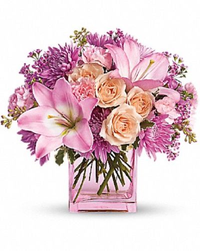 <p>Surprise someone with a bouquet as pretty as a dream and filled with delightful charm. This elegant arrangement offers a graceful expression of beauty and thoughtfulness, making it perfect for brightening any special occasion and bringing joy to those who receive it.</p>
<p>The design features a lovely mix of peach roses, pink Asiatic lilies, miniature carnations, lavender cushion spray chrysanthemums, and waxflower. Accented with pittosporum and seeded eucalyptus, these blooms are artfully arranged in a sleek glass cube, creating a fresh and modern presentation that highlights the soft and soothing palette.</p>
<p>Ideal for birthdays, anniversaries, or simply to say “I’m thinking of you,” this bouquet conveys warmth and affection through its delicate colors and varied textures. The harmonious combination of blooms makes it a versatile and memorable gift suited to many occasions and sentiments.</p>
<p>Each bouquet is handcrafted with care by expert florists who select only the freshest flowers to ensure lasting beauty and vibrancy. Prepared and delivered promptly, the arrangement arrives fresh and beautifully arranged, ready to create a meaningful moment. Personalized messages can be added at checkout to accompany your gift and enhance the sentiment.</p>
<p>Sending this bouquet means offering more than flowers—you share a beautiful moment full of hope, care, and connection. It stands as a thoughtful expression that brightens days, warms hearts, and celebrates the special bonds between people.</p>