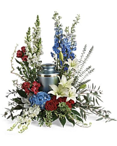 <p>Celebrate a life of pride, service, and patriotism with a floral tribute that commands respect and admiration. This bold and dignified arrangement is designed to honor a loved one with deep gratitude and heartfelt remembrance.</p>
<p>The patriotic bouquet features a stunning mix of red, white, and blue blooms including blue hydrangea, white dendrobium orchids, red roses, white Asiatic lilies, red alstroemeria, red carnations, blue delphinium, and white snapdragons. Complementary greenery such as dusty miller, myrtle, huckleberry, variegated ivy, curly willow, aralia leaves, parvifolia eucalyptus, spiral eucalyptus, and lemon leaf add texture and fullness.</p>
<p>Ideal for families and friends seeking a meaningful tribute to accompany a cremation urn, this arrangement conveys honor, respect, and patriotism. Please note this arrangement does not include the urn itself and serves as a floral complement.</p>
<p>Each tribute is handcrafted by skilled florists who ensure it arrives fresh, beautiful, and respectfully presented. Same-day delivery is available to provide timely and thoughtful service.</p>
<p>Add a personal message to accompany your heartfelt gift. This tribute sends a lasting symbol of love, honor, and remembrance.</p>