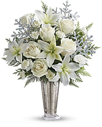 <p>There’s a quiet beauty to winter—the way light dances on snow and moments feel more meaningful in the stillness. This elegant bouquet captures that serene magic, offering a graceful gesture for any seasonal celebration or heartfelt occasion.</p>
<p>A refined palette of white roses, carnations, and chrysanthemums is paired with silvery accents and lush winter greenery, creating a design that feels luxurious yet tranquil. The cool tones echo freshly fallen snow and soft winter light, while the arrangement’s airy elegance fits effortlessly into both modern and traditional settings.</p>
<p>Perfect for December birthdays, winter anniversaries, holiday gatherings, or simply sharing seasonal joy, this bouquet offers timeless charm and versatility. Its neutral hues make it a tasteful choice for home décor, milestone moments, or a sophisticated seasonal gift.</p>
<p>Each arrangement is handcrafted by a local florist, ensuring your bouquet is as fresh and polished as it is heartfelt. Flower varieties and foliage may vary slightly due to availability, but the peaceful beauty and thoughtful design remain constant.</p>
<p>Let your winter wishes shine with a bouquet that radiates elegance, warmth, and the magic of the season.</p>