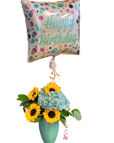 <p>Make their special day unforgettable with a cheerful and vibrant arrangement designed to deliver happiness with every petal. Featuring sunny blooms and a festive mylar balloon, this bouquet is the perfect way to say “Happy Birthday” in bold, beautiful style.</p>
<p>This uplifting design pairs bright sunflowers with lush hydrangeas, creating a stunning contrast of warm yellow and soft texture. Each bloom is hand-selected for freshness and arranged to radiate positivity and charm. Topped with a colorful birthday-themed mylar balloon, this arrangement brings the party wherever it goes—whether delivered to a doorstep, office, or celebration venue.</p>
<p>This arrangement is ideal for all ages and any birthday personality, from fun-loving to heartfelt. Its sunny presence adds joy to the moment and leaves a lasting impression long after the candles have been blown out.</p>
<p>Carefully handcrafted with attention to detail, each bouquet is made fresh to order and prepared with professional presentation. Same-day delivery ensures it arrives fresh and ready to brighten the celebration.</p>
<p>A personal birthday message can be added at checkout to make the gift extra meaningful. This arrangement sends more than flowers—it sends celebration, smiles, and a whole lot of joy.</p>