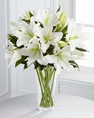 <p>Offer comfort, serenity, and heartfelt condolences with this elegant bouquet designed to express sympathy with quiet strength and graceful beauty. It provides a meaningful way to share support and compassion during times of loss.</p>
<p>The bouquet features stunning Oriental lilies, prized for their soft fragrance and symbolism of purity. Accented with fresh, lush greenery and arranged in a clear glass vase, this design offers a refined and soothing presence. Its simplicity and elegance convey love, remembrance, and the enduring light that lives on in our hearts.</p>
<p>This bouquet is a thoughtful choice for memorial services, funerals, or personal deliveries to friends and family who are grieving. Its all-white color palette and sophisticated design offer a respectful and comforting way to show you care.</p>
<p>Each bouquet is handcrafted with care and attention to detail, ensuring freshness and beauty. Delivered promptly and prepared with compassion, it arrives ready to provide comfort and grace when it is needed most.</p>
<p>Add a personal message during checkout to express your sympathy in a heartfelt way. This bouquet offers more than flowers—it provides comfort, support, and a gentle reminder that love and remembrance endure beyond loss.</p>