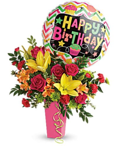 <p>No celebration is complete without flowers, and this vibrant arrangement is the perfect way to kick off the party. Bursting with bold colors and topped with a cheerful balloon, it delivers joy, fun, and unforgettable birthday cheer that lights up any room.</p>
<p>The lively bouquet features hot pink roses, sunny yellow Asiatic lilies, orange alstroemeria, red miniature carnations, green button spray chrysanthemums, huckleberry, and oregonia. These vibrant blooms are presented in a raspberry-hued tapered vase that adds a playful and polished touch. A festive mylar balloon crowns the arrangement, making it a complete birthday package that delights both the eyes and the spirit.</p>
<p>Ideal for friends, family, coworkers, or anyone deserving of a colorful surprise on their special day, this bouquet’s bright colors and energetic mix make it a standout centerpiece for parties or a thoughtful gift that truly shows you care.</p>
<p>Each arrangement is handcrafted with care by skilled florists who select and arrange fresh flowers to ensure lasting beauty and vibrancy. Prepared and delivered promptly, the bouquet arrives ready to brighten the celebration. Personalized messages can be added at checkout to help create a memorable moment.</p>
<p>Sending this arrangement means offering more than flowers—you deliver a full-on celebration wrapped in color and cheer. It stands as a joyful expression of love and happiness, perfect for making birthdays bloom in the brightest way possible.</p>